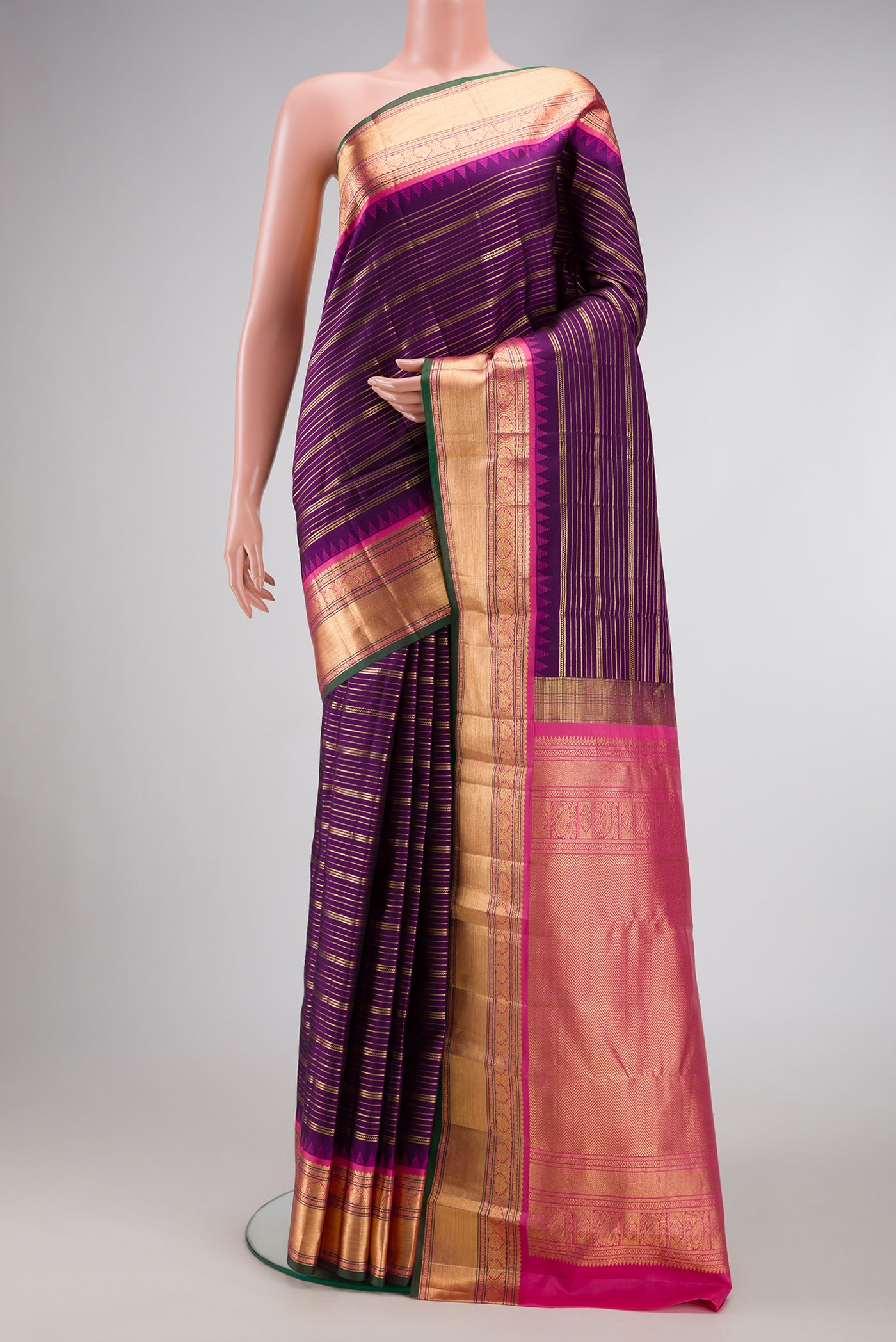 Violet Dual Tone Kanjivaram Silk Saree with Stripes on the body and Zari Border.  displayed on a mannequin