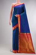Pure Silk Peacock Blue Kanjivaram Saree with Checked design on the body and Zari Border.  displayed on a mannequin