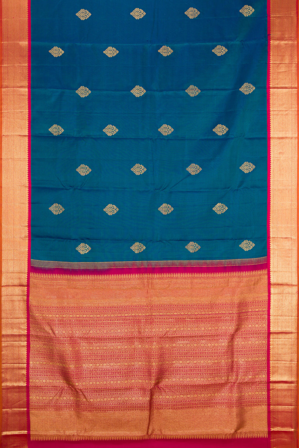 Flat view of Peacock Blue Kanjivaram Silk Saree with Zari Butta on the body and Zari Border. 