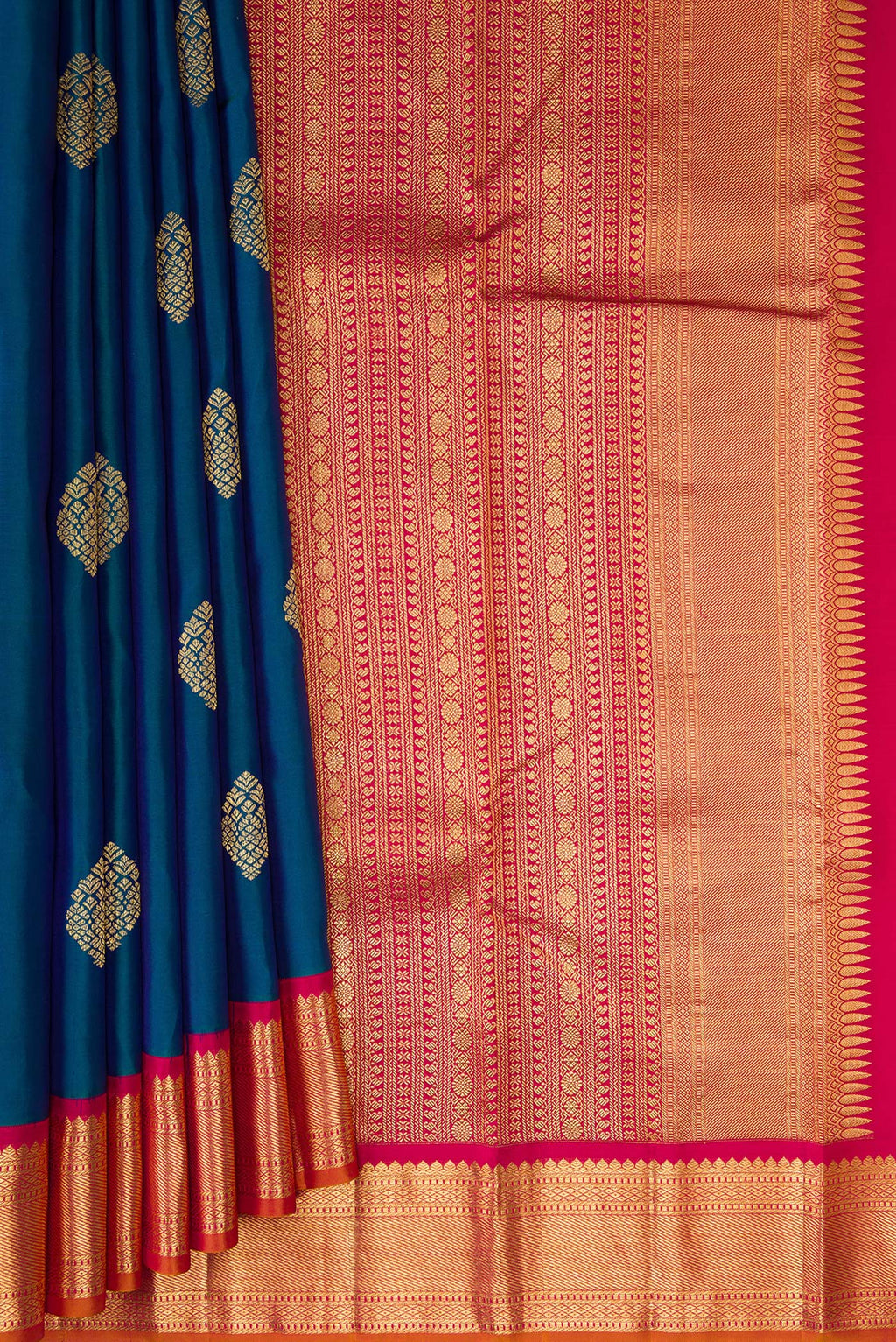 Pleats and pallu of Peacock Blue Kanjivaram Silk Saree with Zari Butta on the body and Zari Border. 