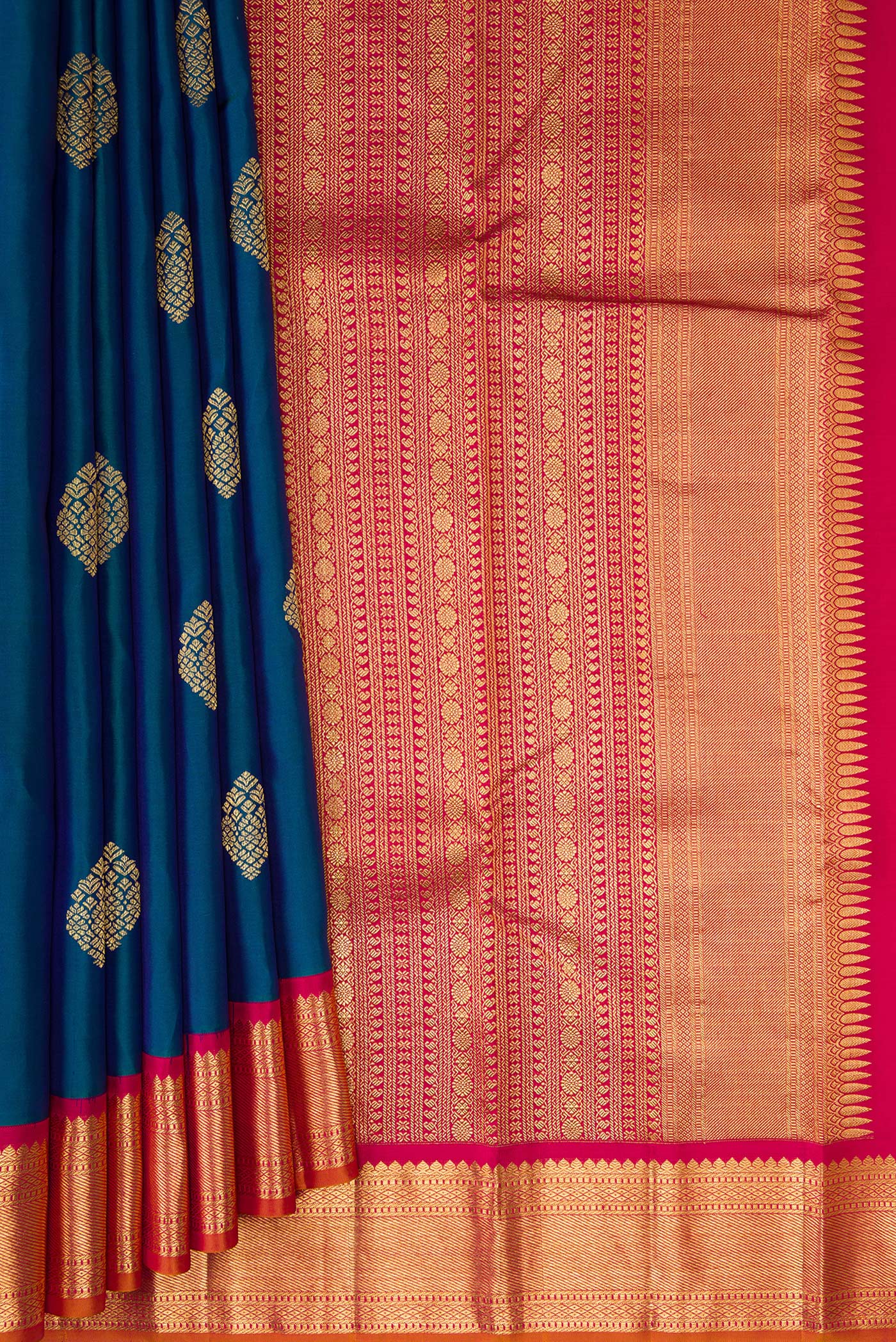 Pleats and pallu of Peacock Blue Kanjivaram Silk Saree with Zari Butta on the body and Zari Border. 