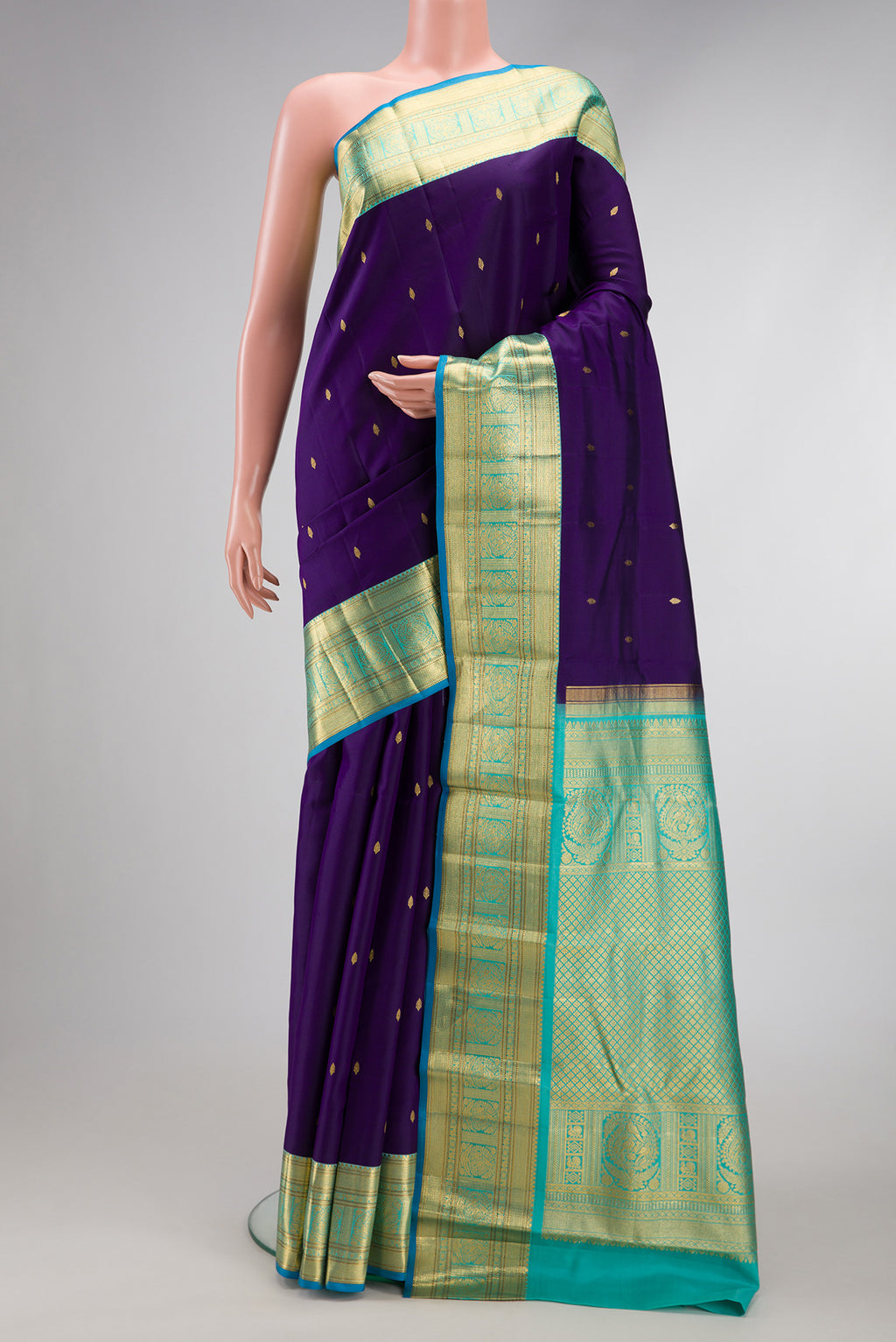 Violet Dual Tone Kanjivaram Silk Saree with Zari Butta on the body and Zari Border.  displayed on a mannequin