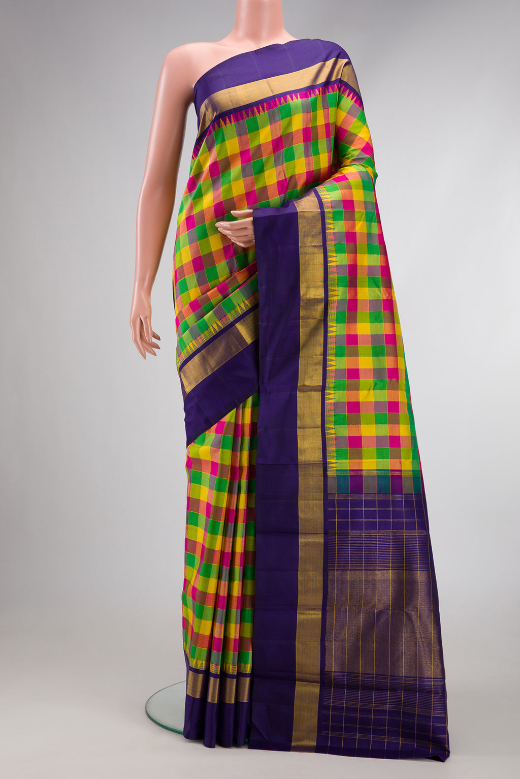 Pure Silk Pure Zari Green, Pink and Yellow Color Kanjivaram Saree with Checked design on the body and Zari Border.  displayed on a mannequin