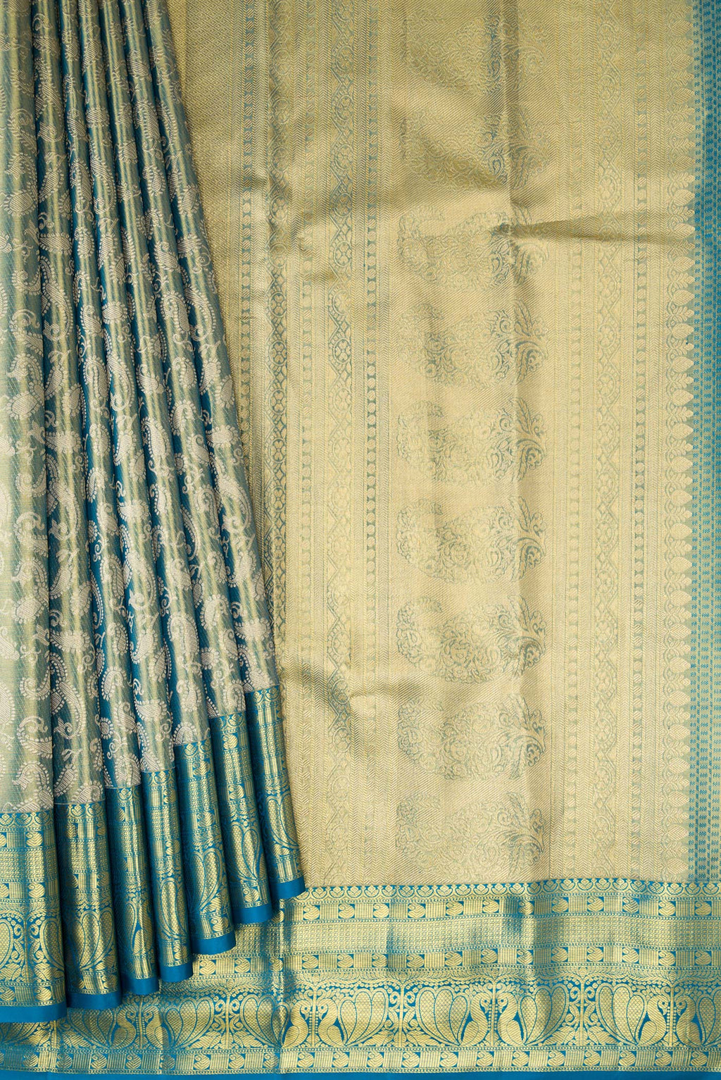 Pleats and pallu of Green Dual Tone Kanchipuram Tissue Silk Saree with Zari Brocade on the body and Zari Border. 