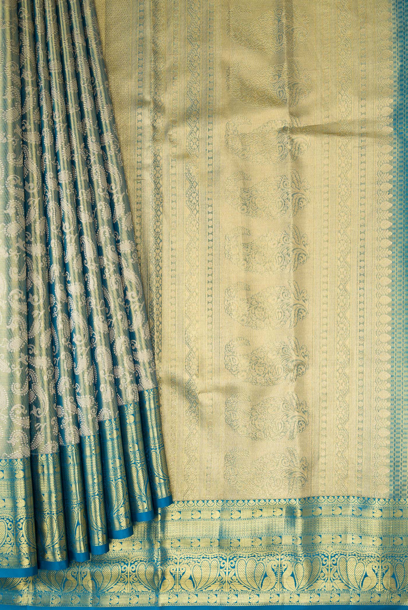 Pleats and pallu of Green Dual Tone Kanchipuram Tissue Silk Saree with Zari Brocade on the body and Zari Border. 