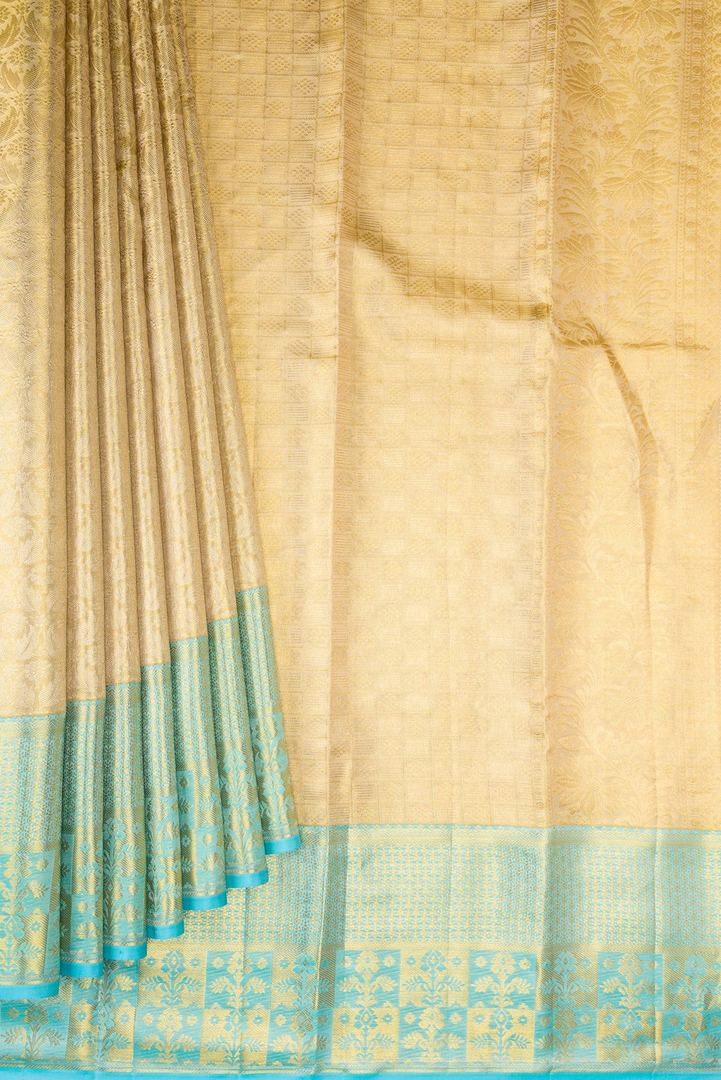 Pleats and pallu of Gold Kanchipuram Tissue Silk Saree with Zari Brocade on the body and Fancy Border. 