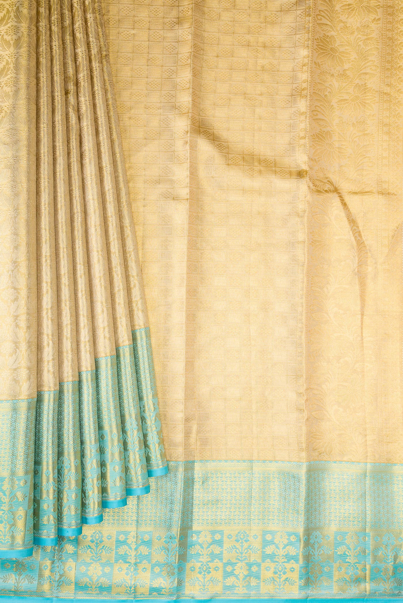 Pleats and pallu of Gold Kanchipuram Tissue Silk Saree with Zari Brocade on the body and Fancy Border. 
