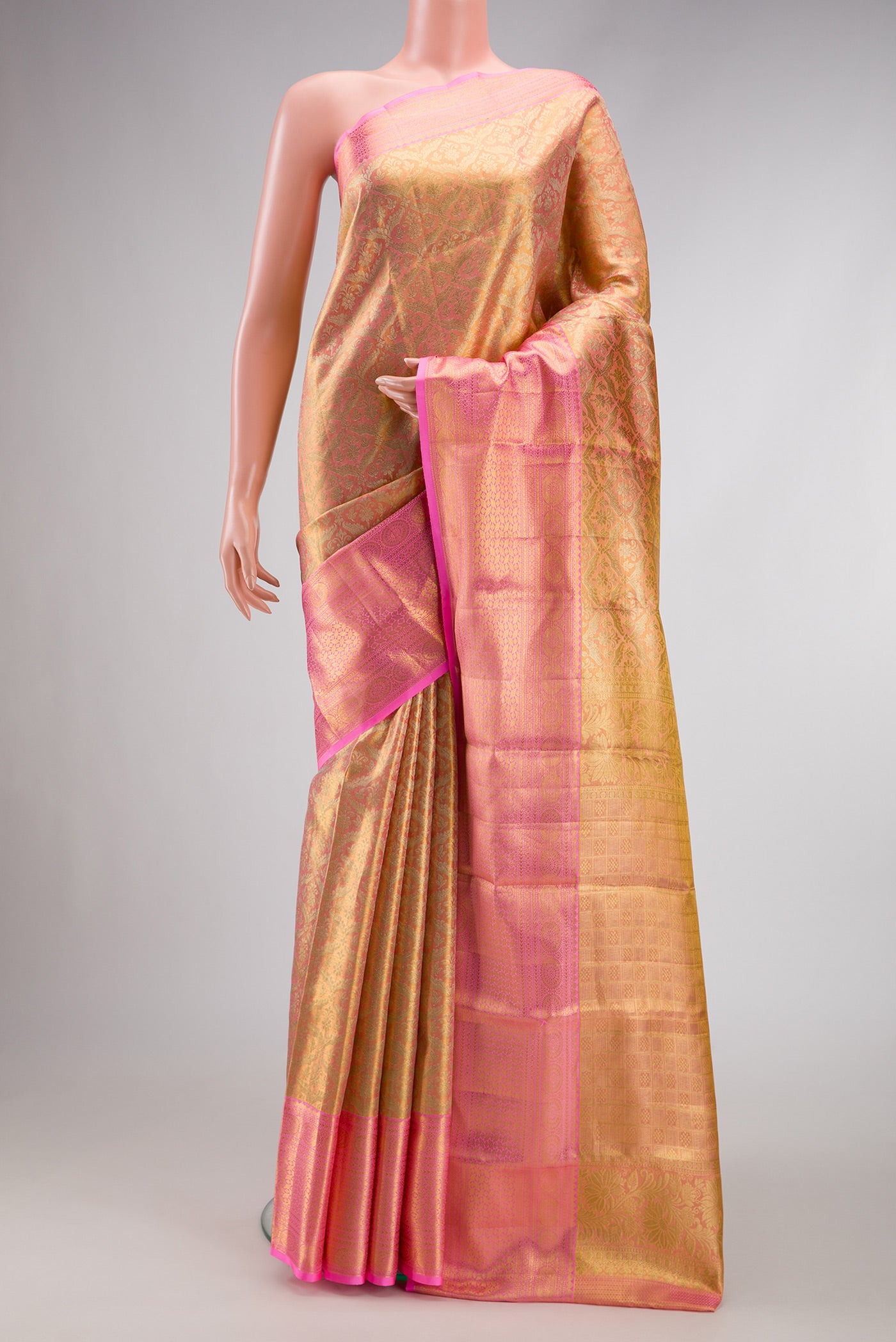 Pink Dual Tone Kanchipuram Tissue Silk Saree with Zari Brocade on the body and Zari Border.  displayed on a mannequin