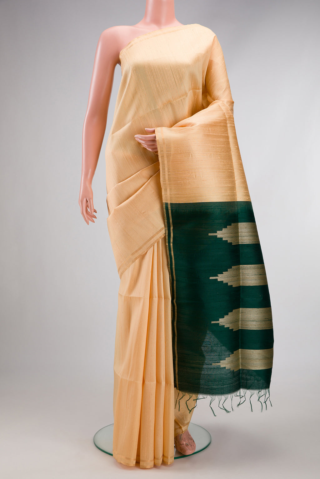 Sandal Raw Silk Saree with Plain Body and Thin Zari Line.  displayed on a mannequin