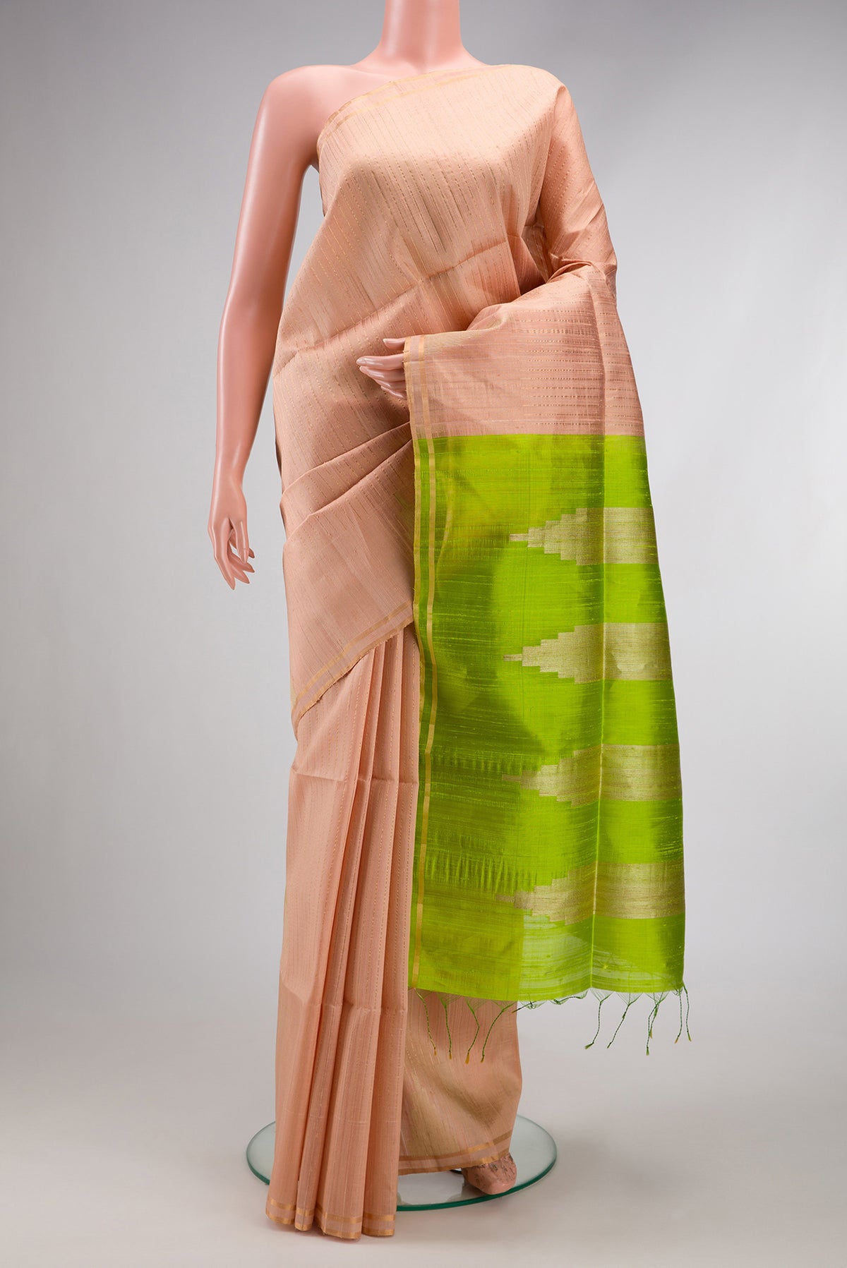 Rose pink Dual Tone Raw Silk Saree with Stripes on the body and Temple Border.  displayed on a mannequin