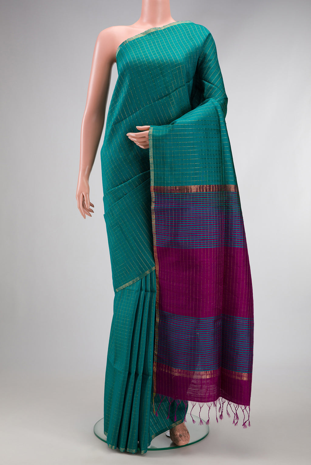 Peacock Blue Raw Silk Saree with Checked design on the body and Zari Border.  displayed on a mannequin