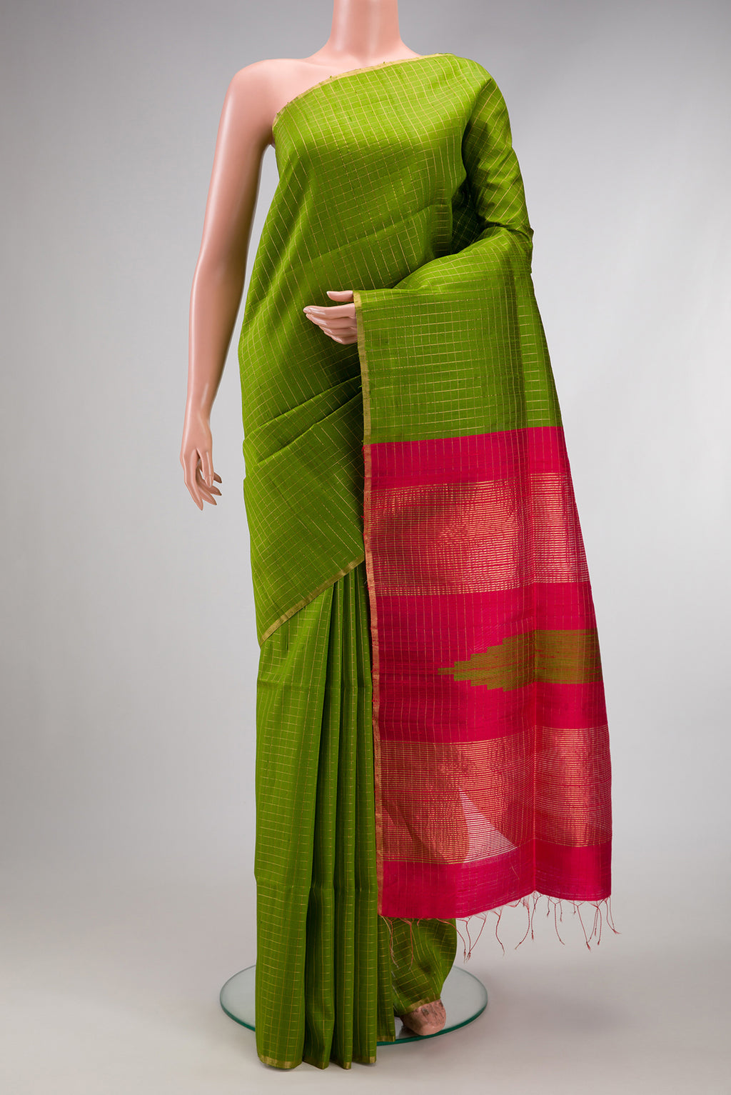 Green Dual Tone Raw Silk Saree with Checked design on the body and Zari Border.  displayed on a mannequin