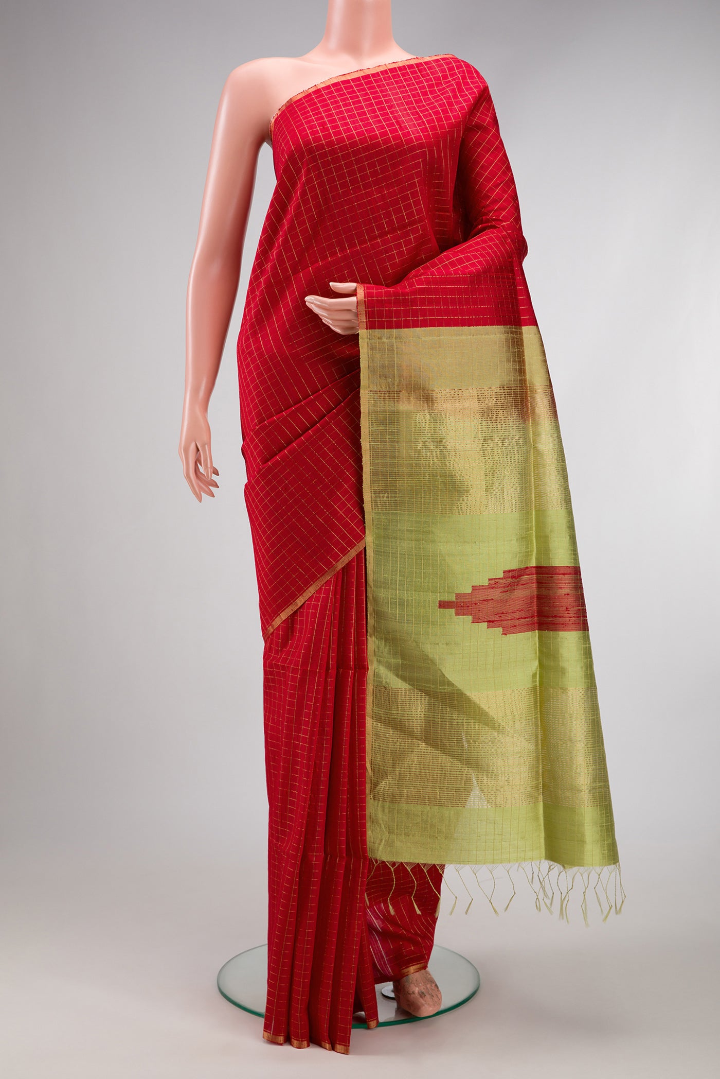 Red Raw Silk Saree with Checked design on the body and Zari Border.  displayed on a mannequin