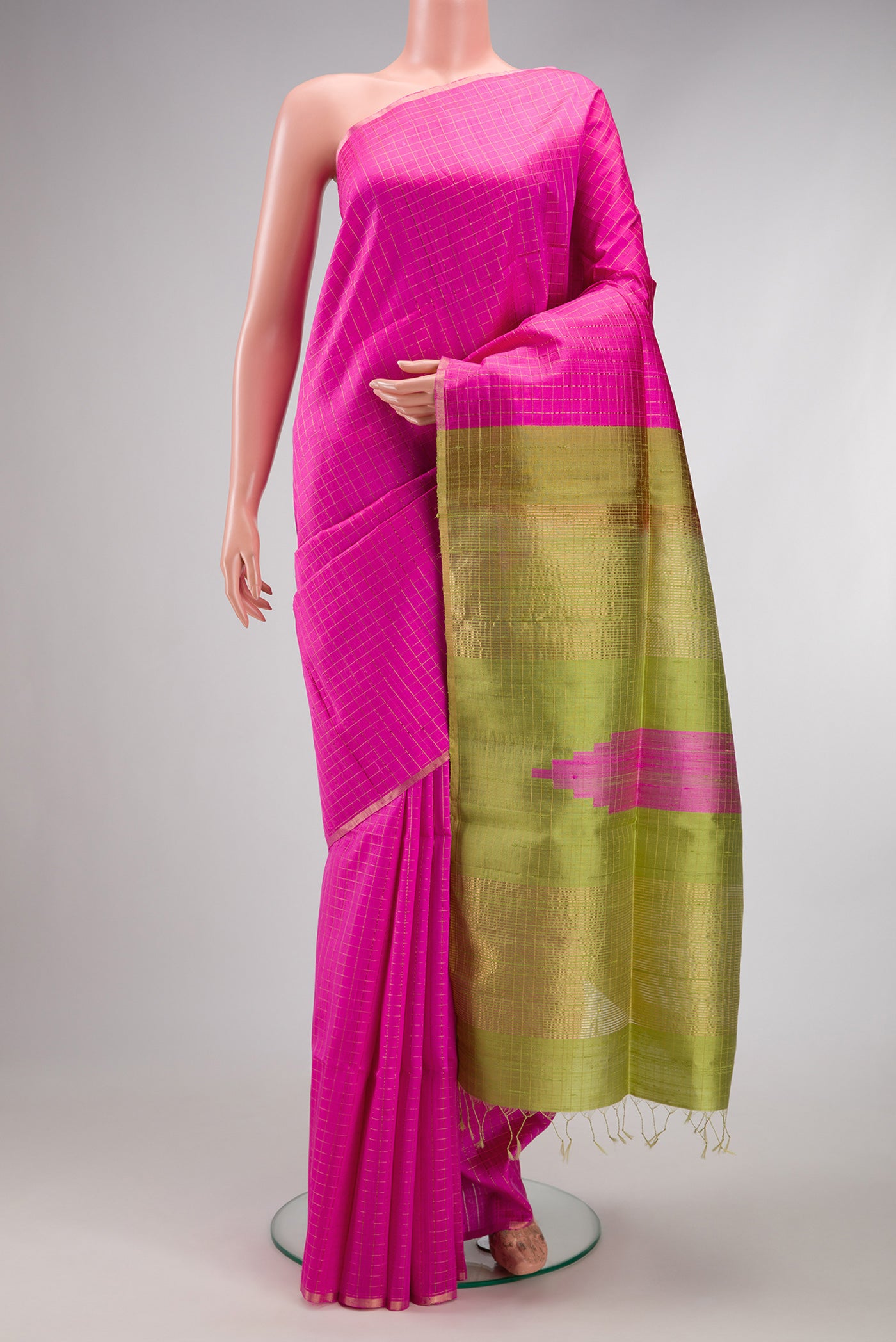Pink Raw Silk Saree with Checked design on the body and Zari Border.  displayed on a mannequin
