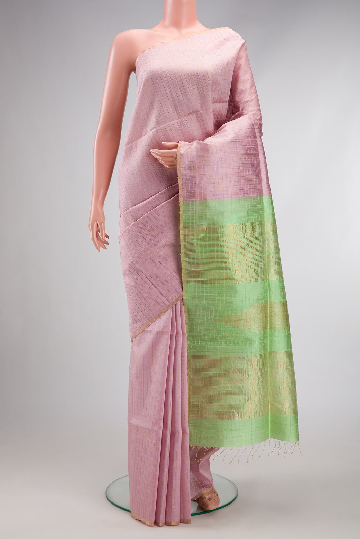 Lavender Raw Silk Saree with Checked design on the body and Thin Zari Line.  displayed on a mannequin