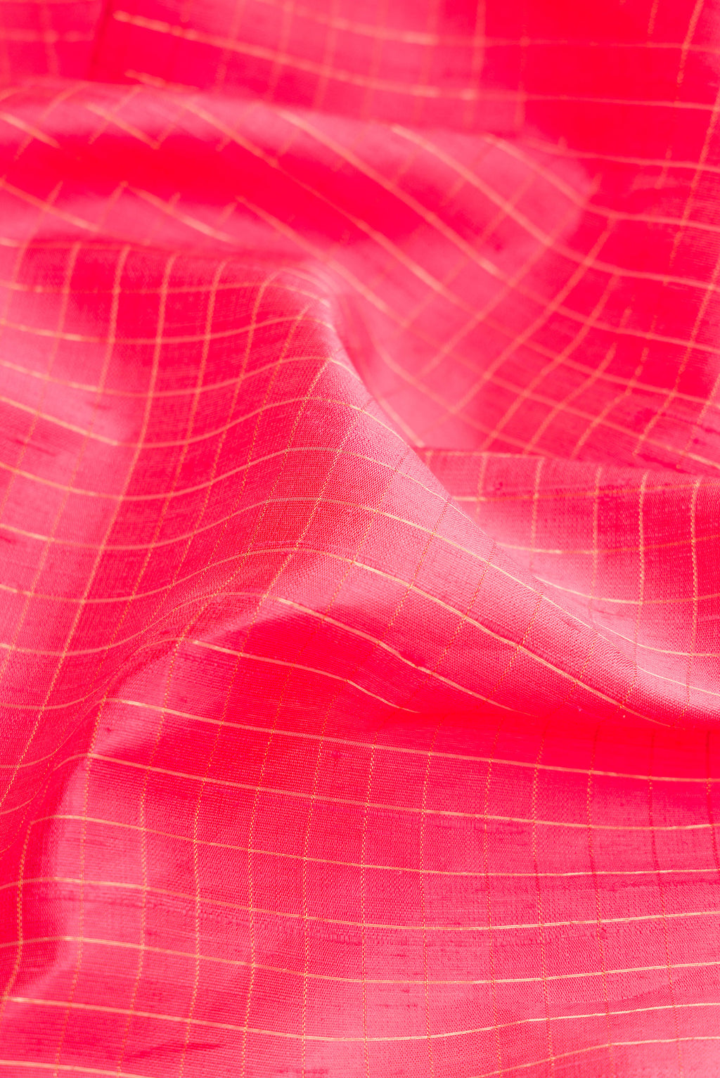 Close up of Pink Dual Tone Raw Silk Saree with Checked design on the body and Zari Border.  displaying folds