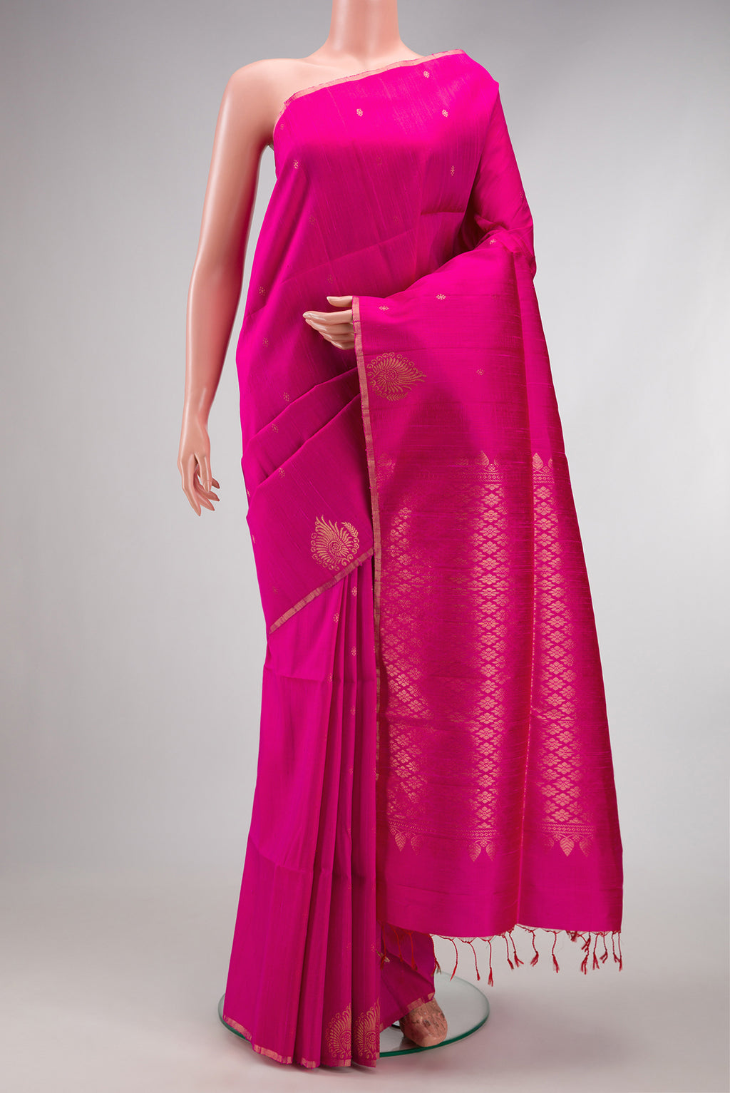 Pink Raw Silk Saree with Zari Butta on the body and Fancy Border.  displayed on a mannequin