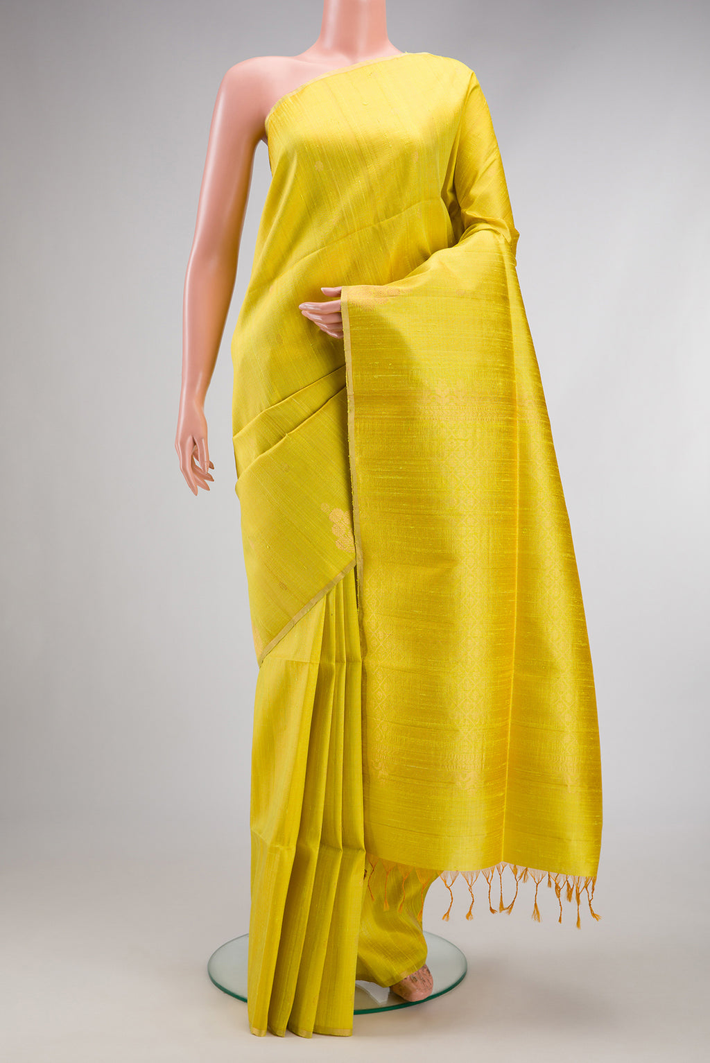Lemon Yellow Dual Tone Raw Silk Saree with Zari Butta on the body and Zari Border.  displayed on a mannequin
