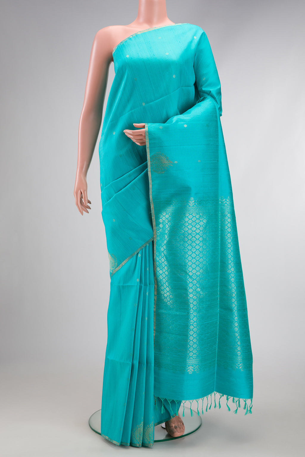 Sky Blue Dual Tone Raw Silk Saree with Zari Butta on the body and Zari Border.  displayed on a mannequin