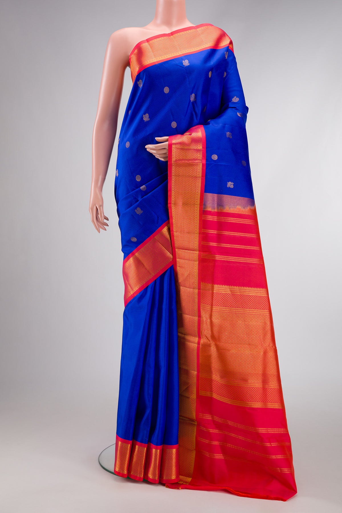 Pure Silk Pure Zari Royal Blue Dual Tone Kanjivaram Nine Yards Saree with Zari Butta on the body and Zari Border.  displayed on a mannequin