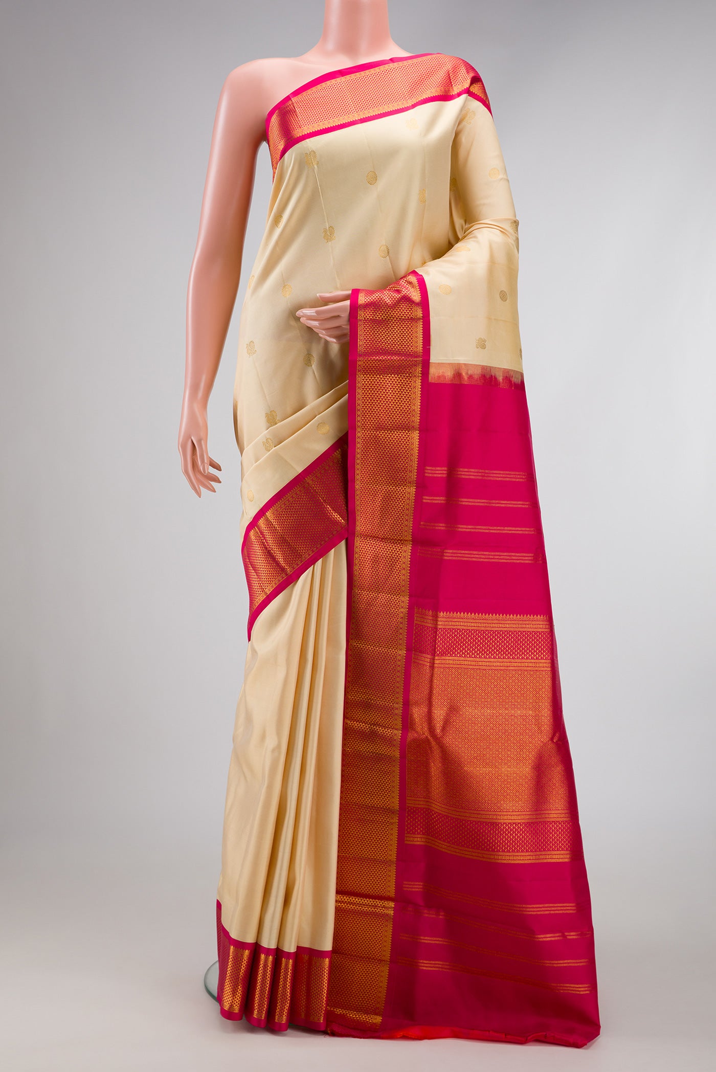 Pure Silk Pure Zari Off White Dual Tone Kanjivaram Nine Yards Saree with Zari Butta on the body and Zari Border.  displayed on a mannequin