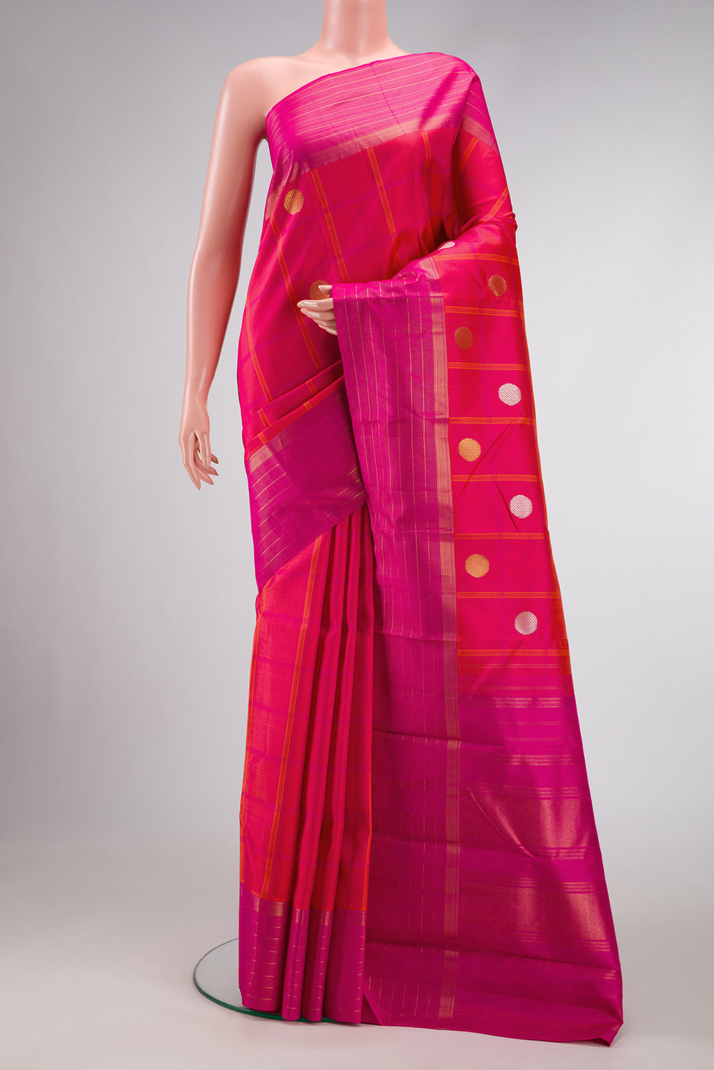 Pure Silk Pure Zari Coral Dual Tone Kanjivaram Saree with Checked design on the body and Zari Border.  displayed on a mannequin