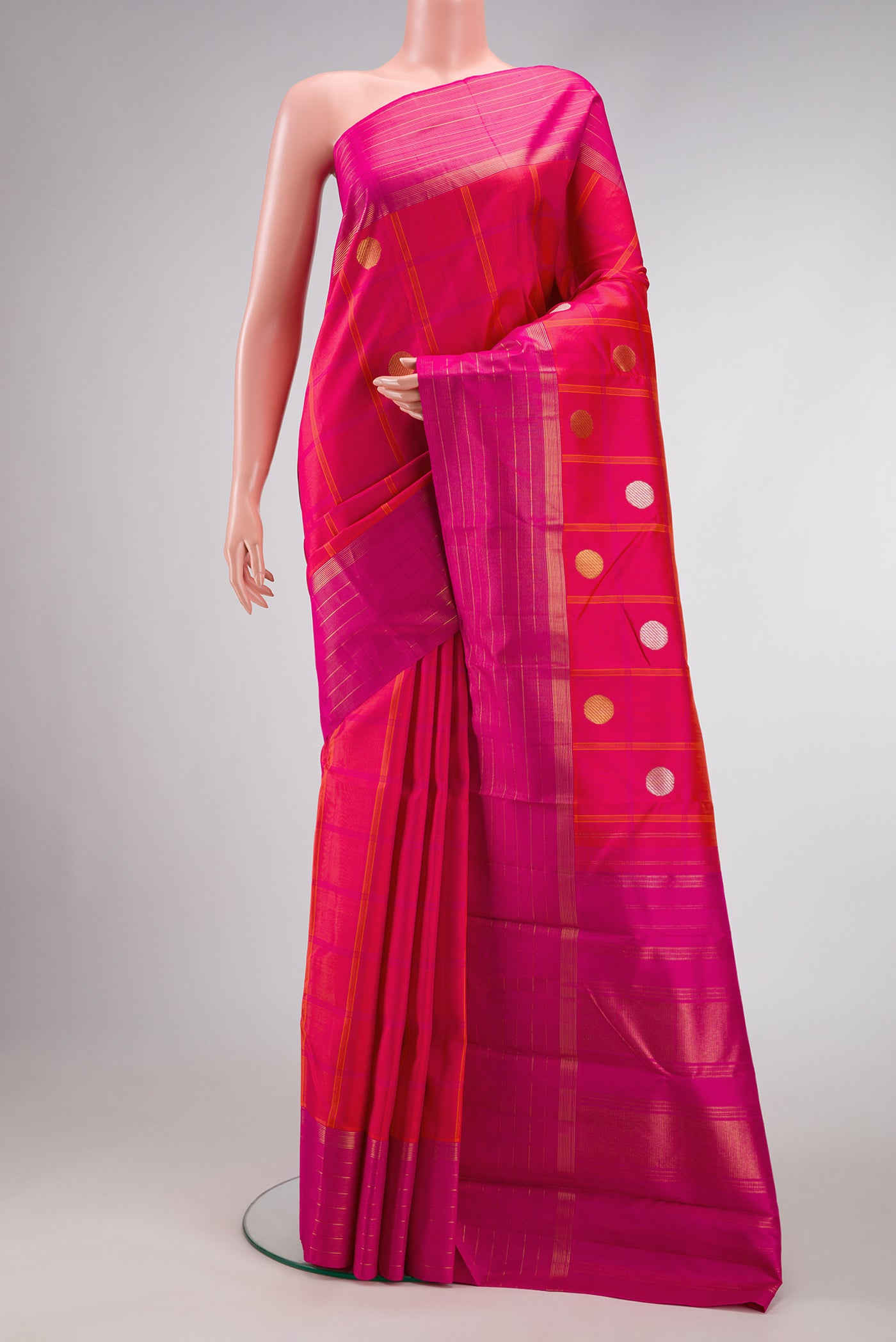 Pure Silk Pure Zari Coral Dual Tone Kanjivaram Saree with Checked design on the body and Zari Border.  displayed on a mannequin