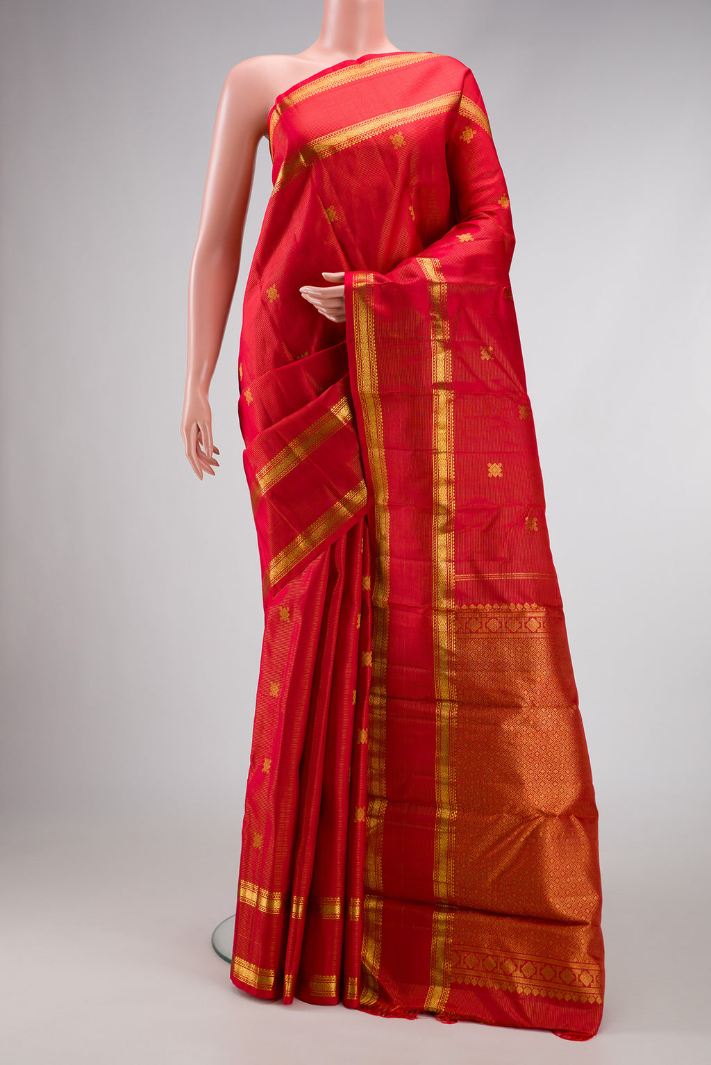 Pure Silk Pure Zari Red Dual Tone Kanjivaram Saree with Stripes on the body and Zari Border.  displayed on a mannequin