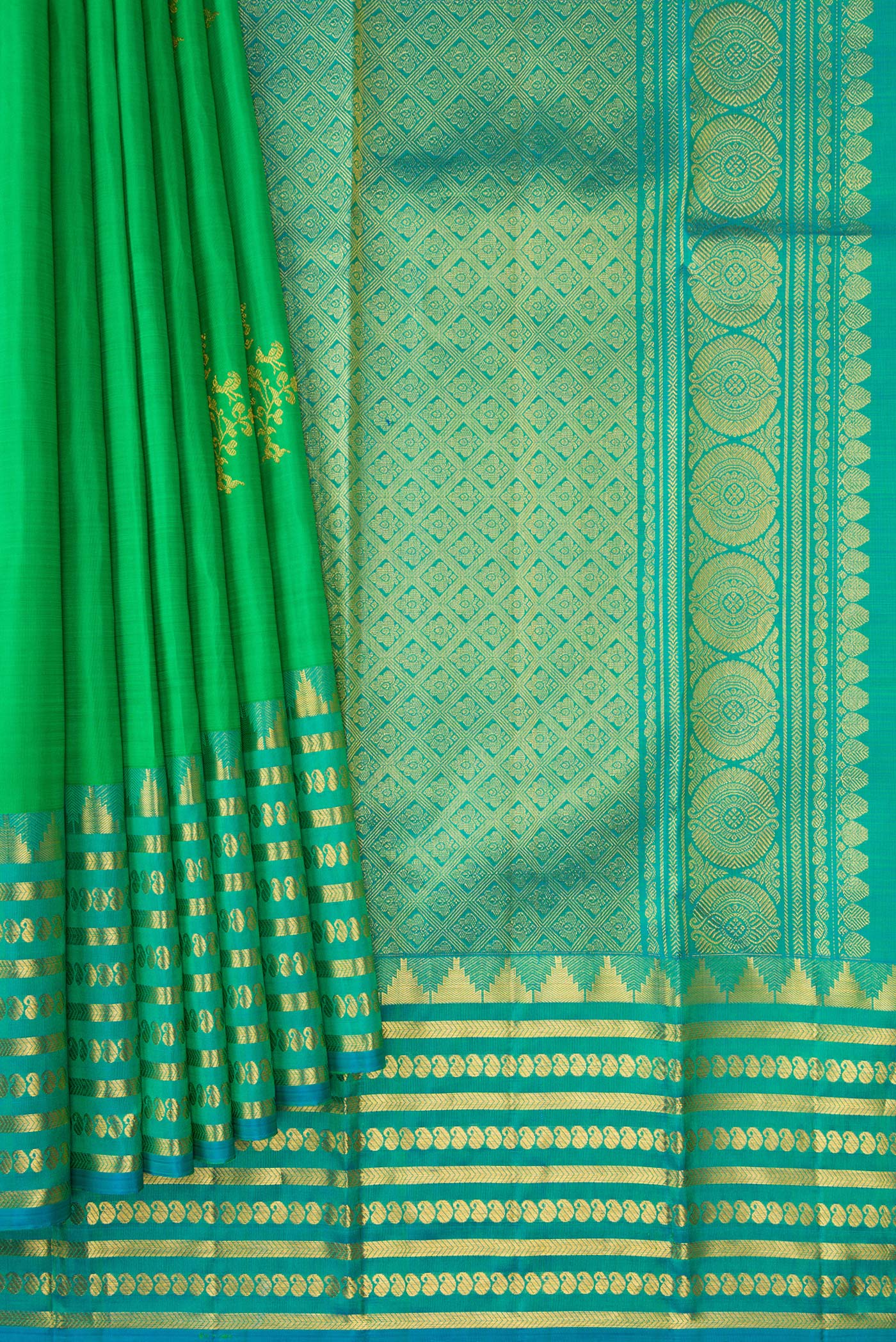 Pleats and pallu of Green Kanchipuram Silk Saree with Zari Butta on the body and Fancy Border. 
