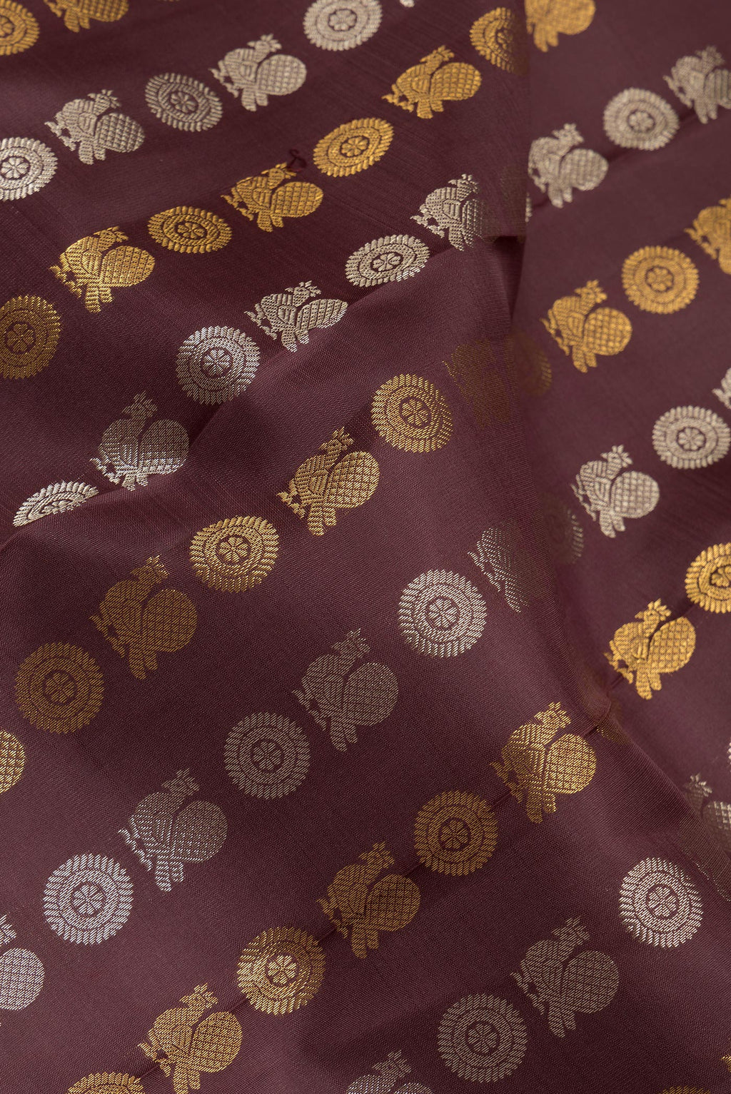 Close up of Pure Silk Coffee Brown Kanjivaram Saree with Zari Butta on the body and Zari Border.  displaying folds