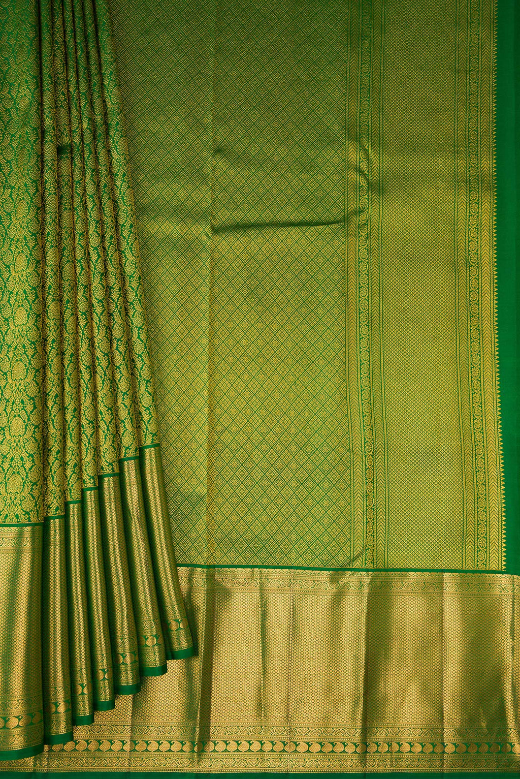 Pleats and pallu of Green Kanchipuram Silk Saree with Zari Brocade on the body and Zari Border. 