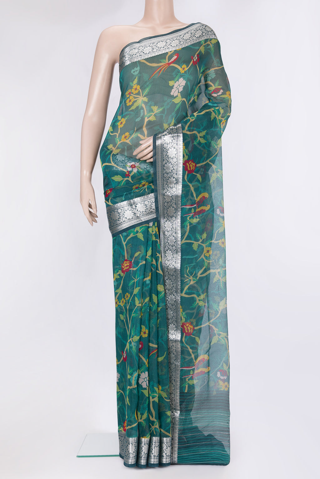 Peacock Blue Organza Silk Saree with Bird Print on the body and Zari Border.  displayed on a mannequin
