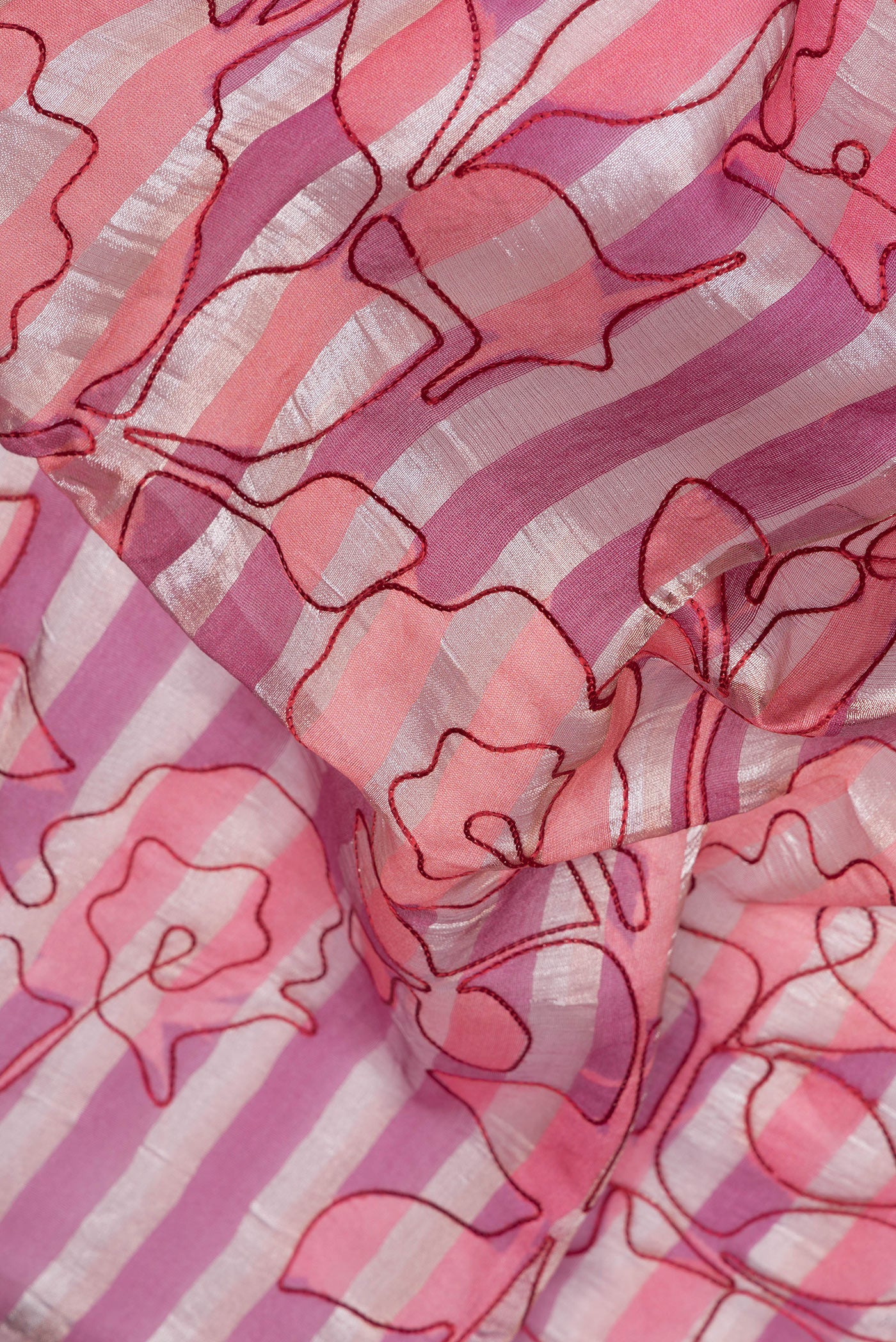 Close up of Purple Organza Silk Saree with Stripes on the body and Without Border.  displaying folds