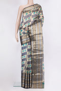 Beige Tussar Saree with Printed design on the body and Zari And Thread Border.  displayed on a mannequin