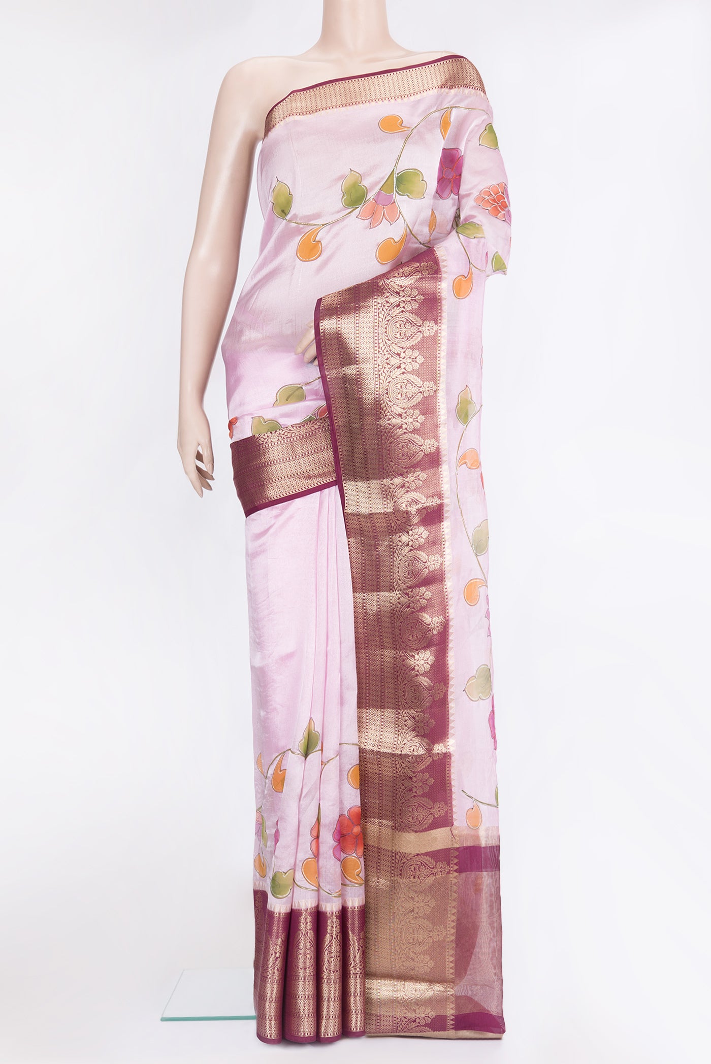 Pink Tussar Silk Saree with Embroidery on the body and Zari Border.  displayed on a mannequin
