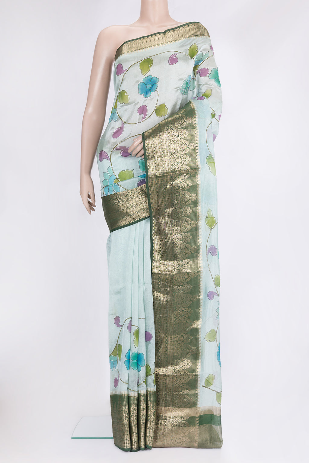 Sky Blue Tussar Silk Saree with Embroidery on the body and Zari Border.  displayed on a mannequin