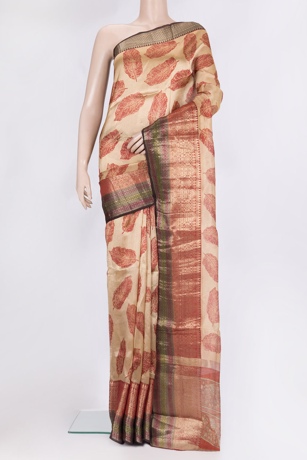 Pure Silk Beige Tussar Saree with Printed design on the body and Thread Border.  displayed on a mannequin