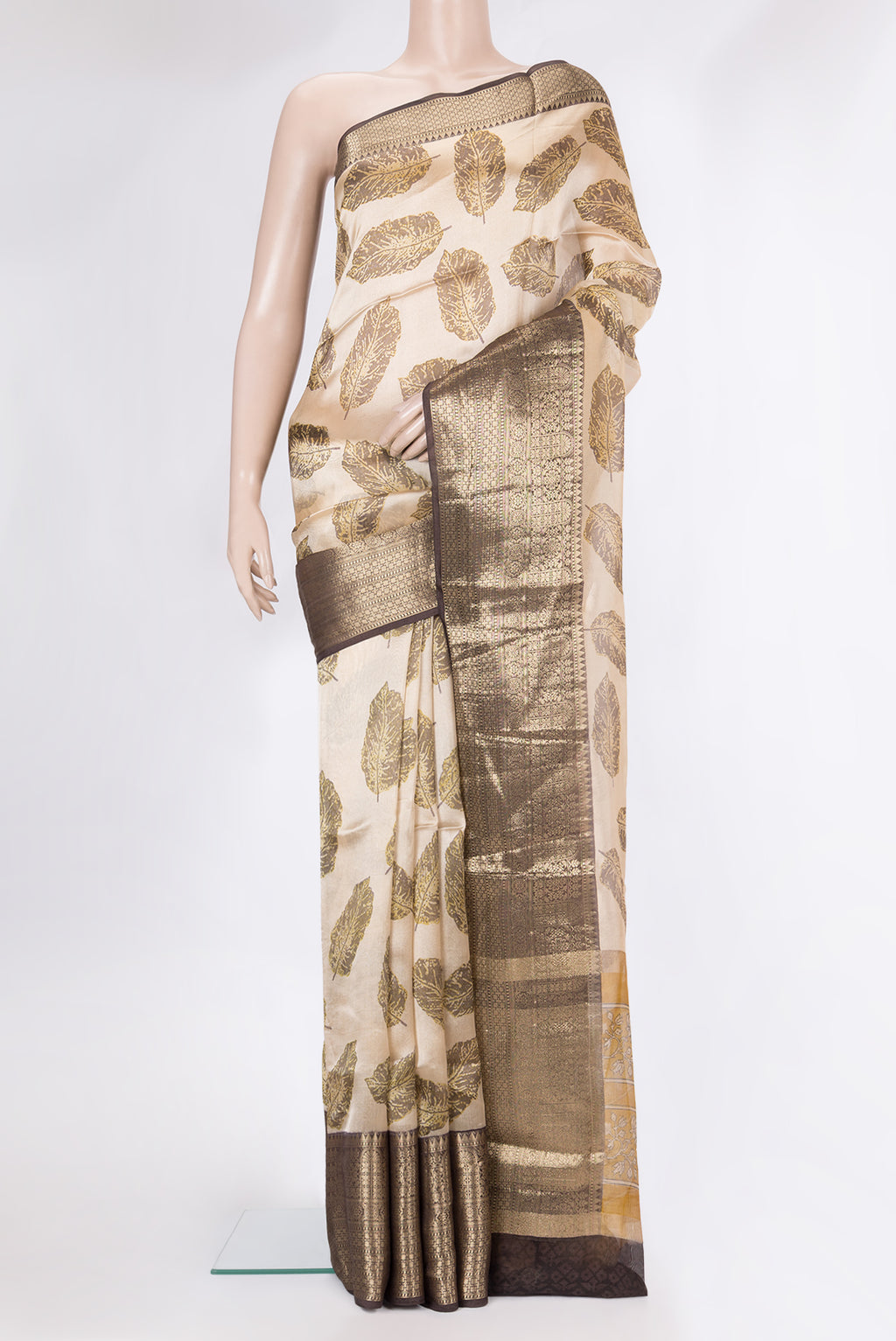 Beige Organza Silk Saree with Printed design on the body and Fancy Border.  displayed on a mannequin