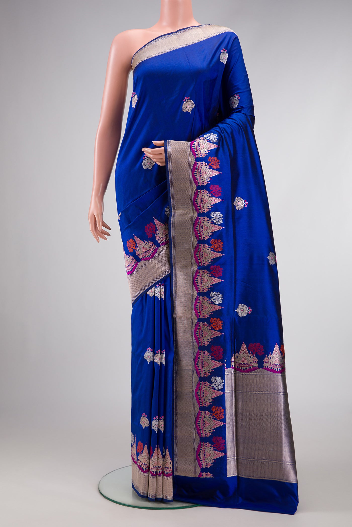 Royal Blue Dual Tone Banarasi Silk Saree with Zari And Thread Butta on the body and Fancy Border.  displayed on a mannequin