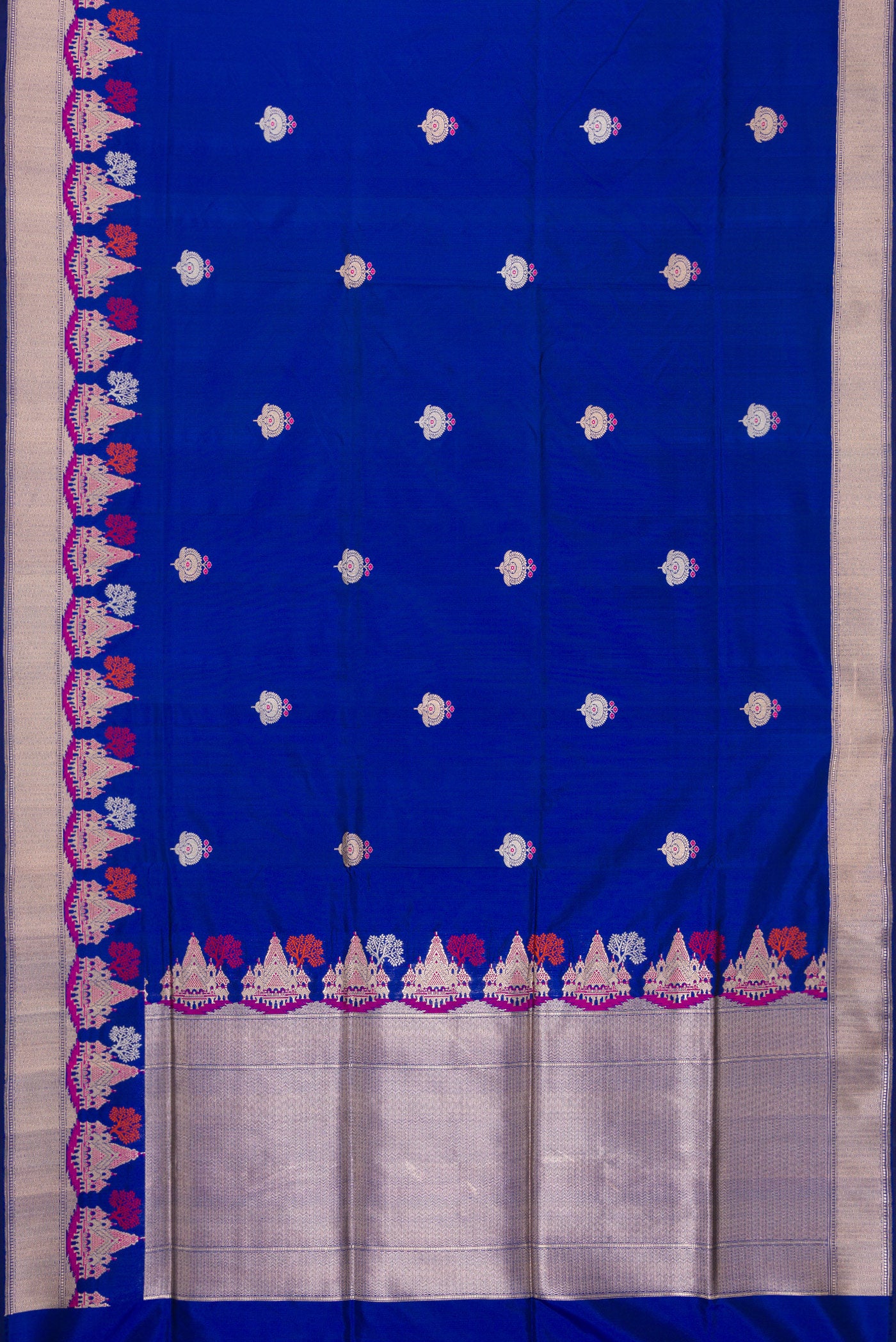 Flat view of Royal Blue Dual Tone Banarasi Silk Saree with Zari And Thread Butta on the body and Fancy Border. 