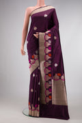 Burgundy Dual Tone Banarasi Silk Saree with Zari And Thread Butta on the body and Fancy Border.  displayed on a mannequin