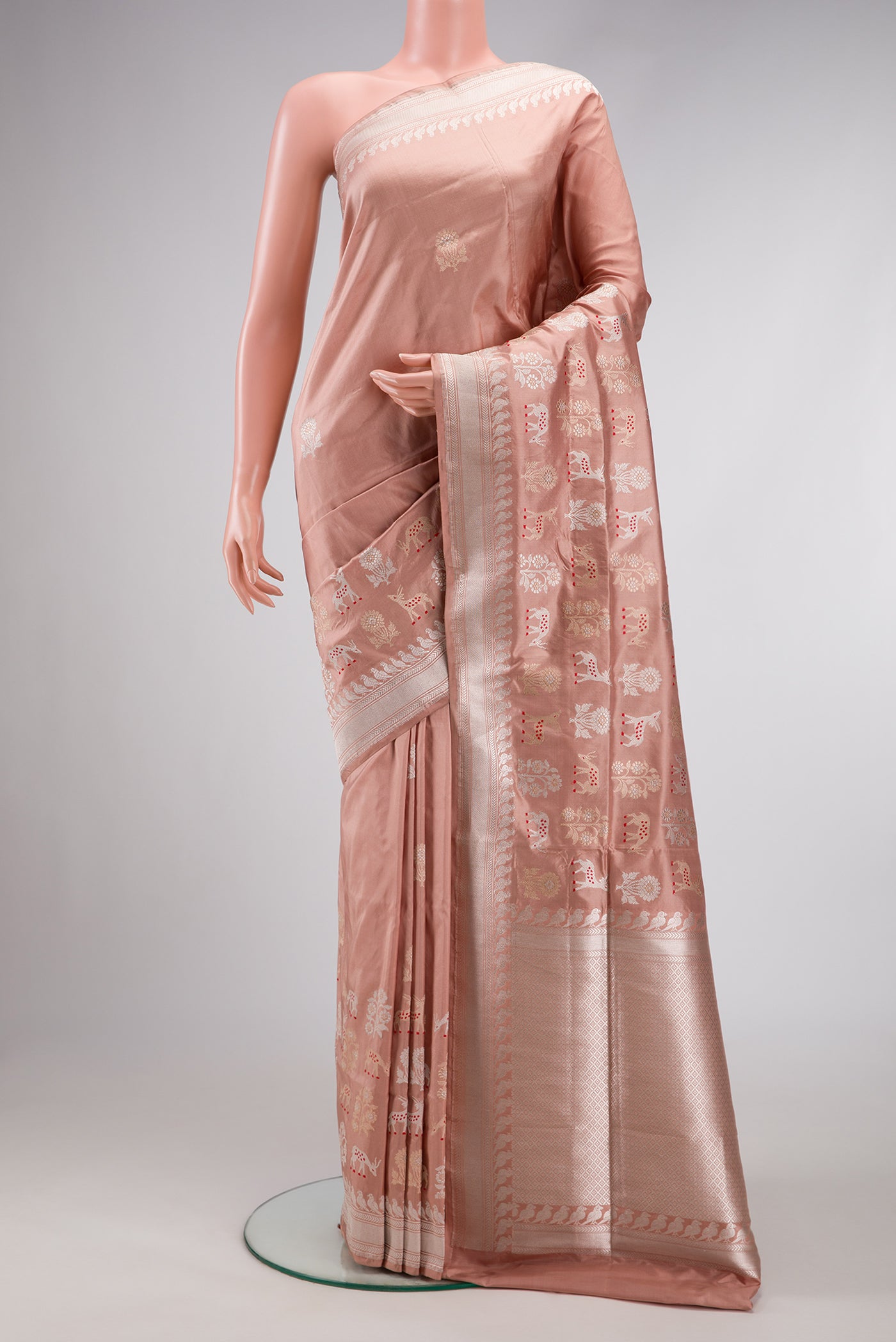 Golden Peach Dual Tone Banarasi Silk Saree with Zari And Thread Butta on the body and Fancy Border.  displayed on a mannequin