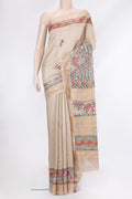 Beige Tussar Silk Saree with Printed design on the body and Fancy Border.  displayed on a mannequin
