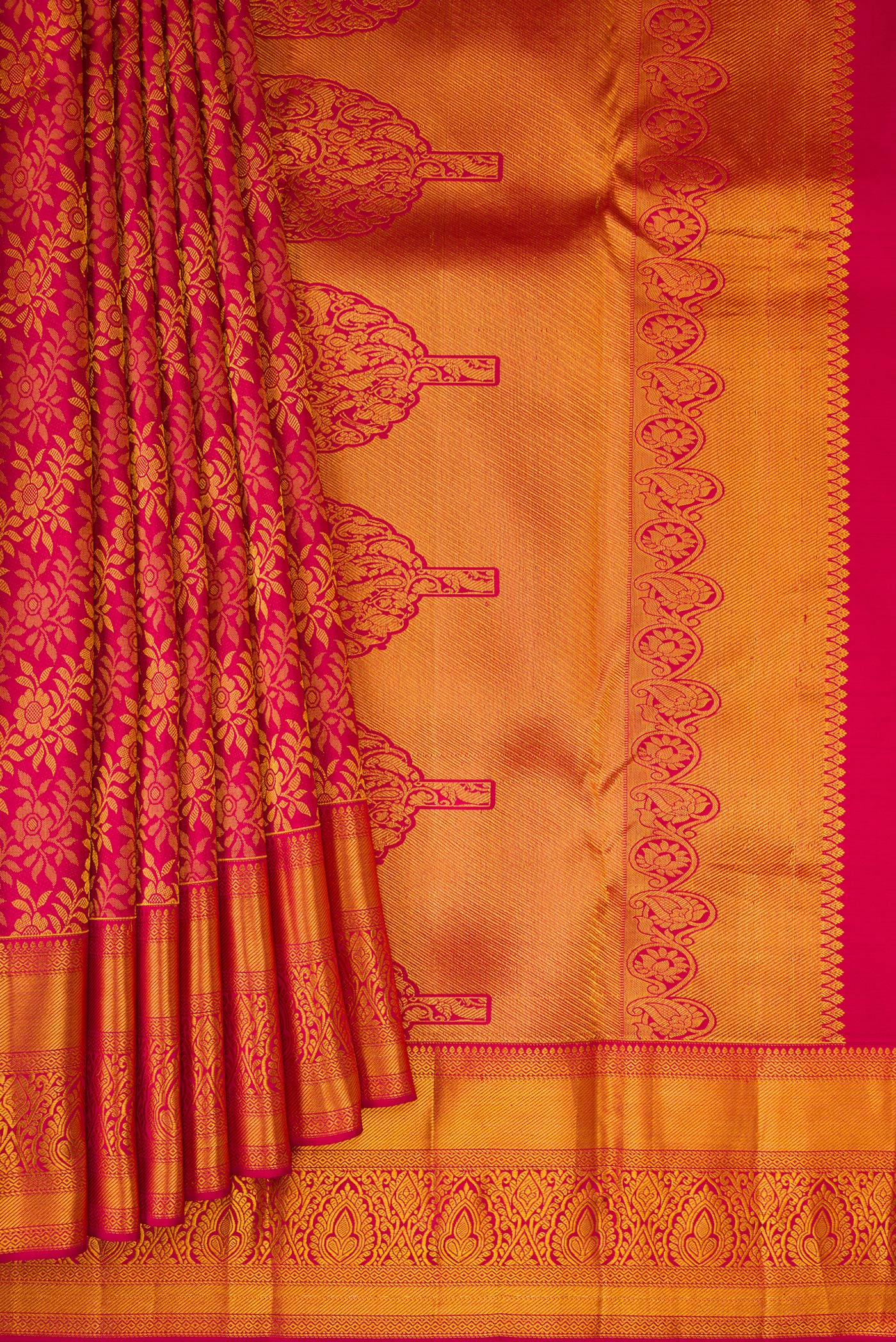 Pleats and pallu of Dark Pink Kanjivaram Silk Saree with Zari Brocade on the body and Zari Border. 