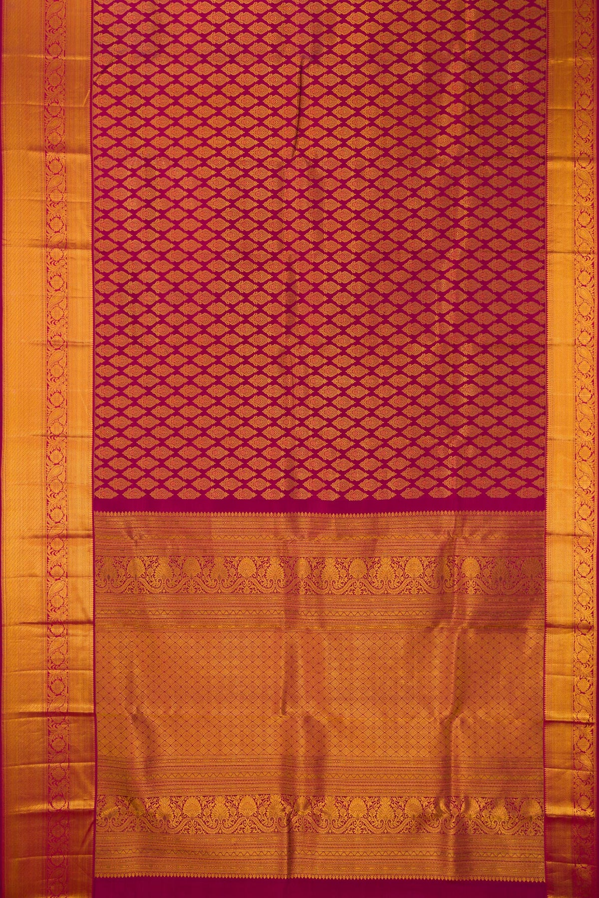 Flat view of Pure Silk Maroon Kanjivaram Saree with Zari Brocade on the body and Zari Border. 