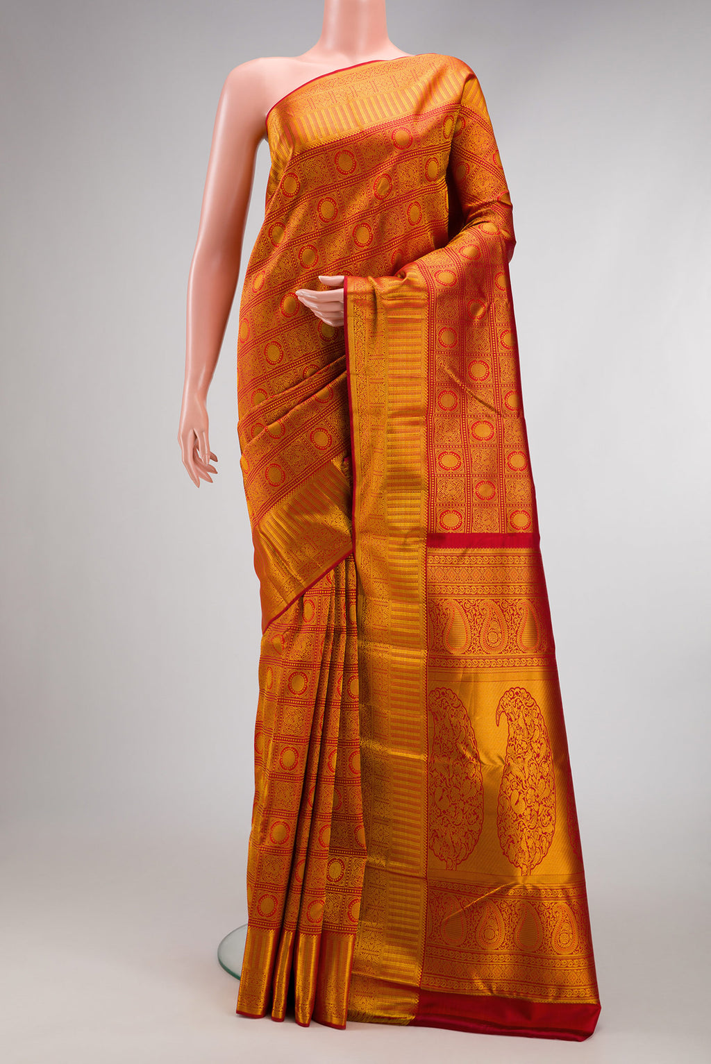 Dark Pink Dual Tone Kanjivaram Silk Saree with Zari Brocade on the body and Zari Border.  displayed on a mannequin