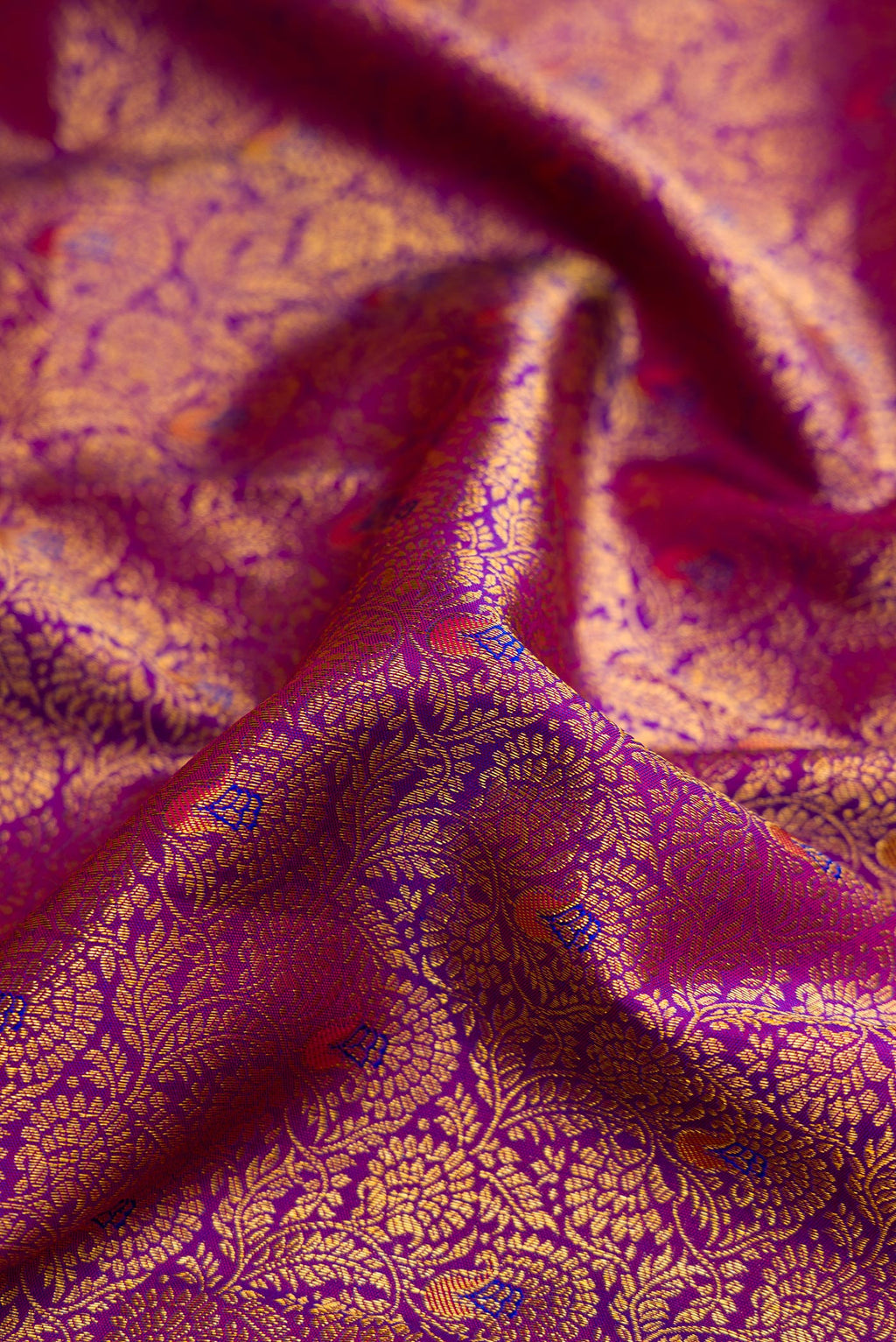 Close up of Purple Kanjivaram Silk Saree with Zari Brocade on the body and Zari Border.  displaying folds