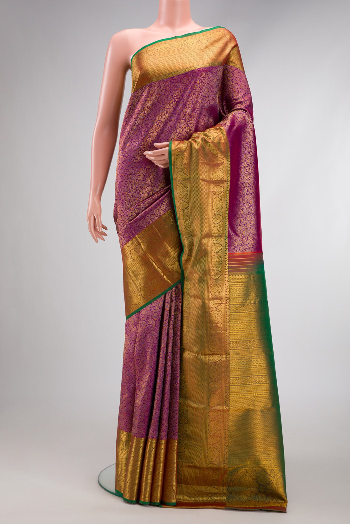 Purple Kanjivaram Silk Saree with Zari Brocade on the body and Zari Border.  displayed on a mannequin