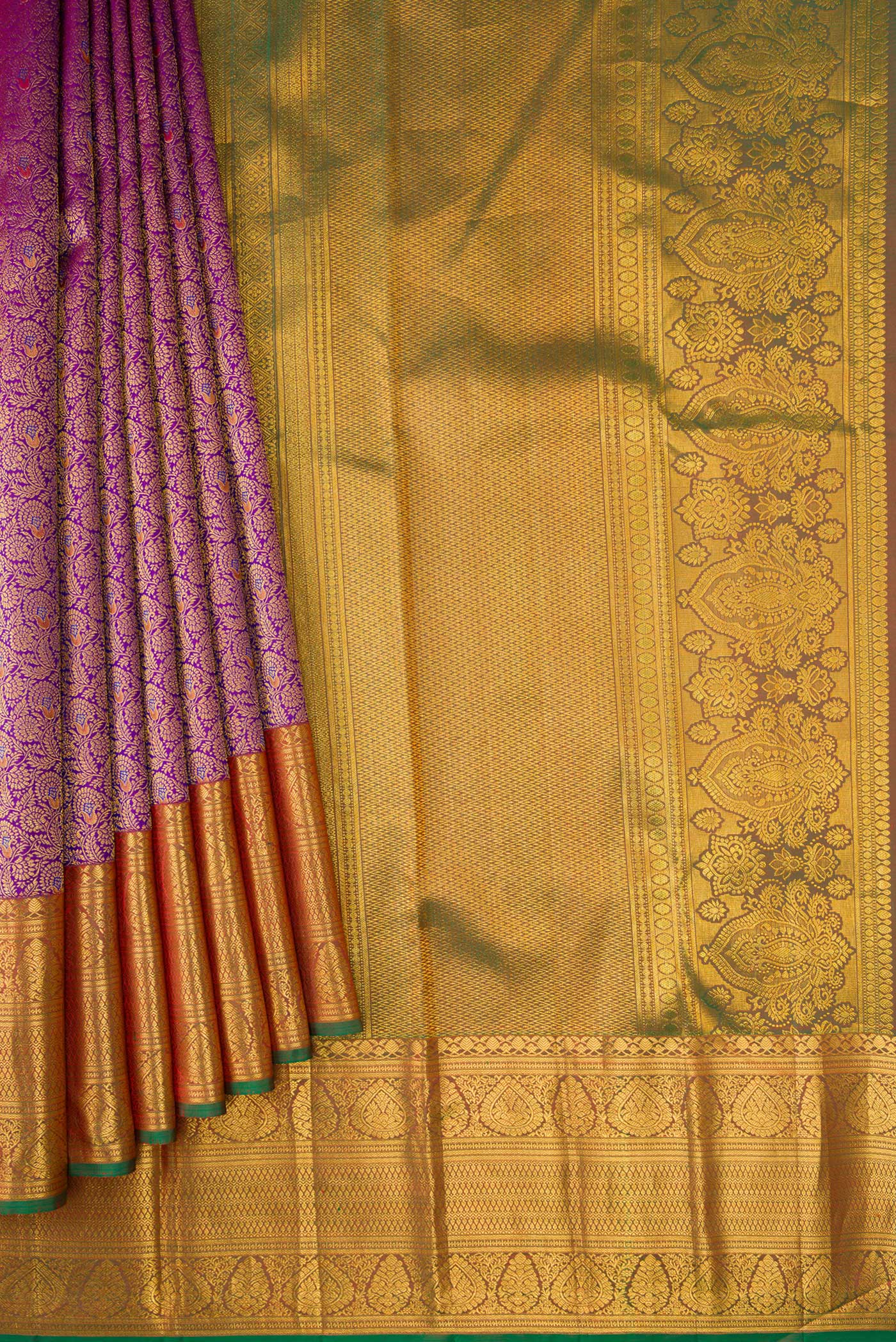 Pleats and pallu of Purple Kanjivaram Silk Saree with Zari Brocade on the body and Zari Border. 