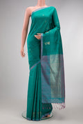 Peacock Blue Soft Silk Saree with Checked design on the body and Plain Border.  displayed on a mannequin